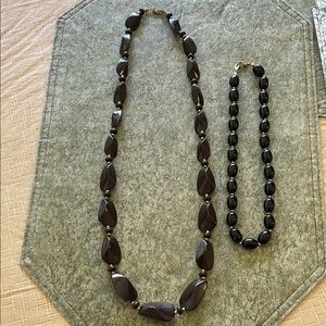Two black/goldtone necklaces